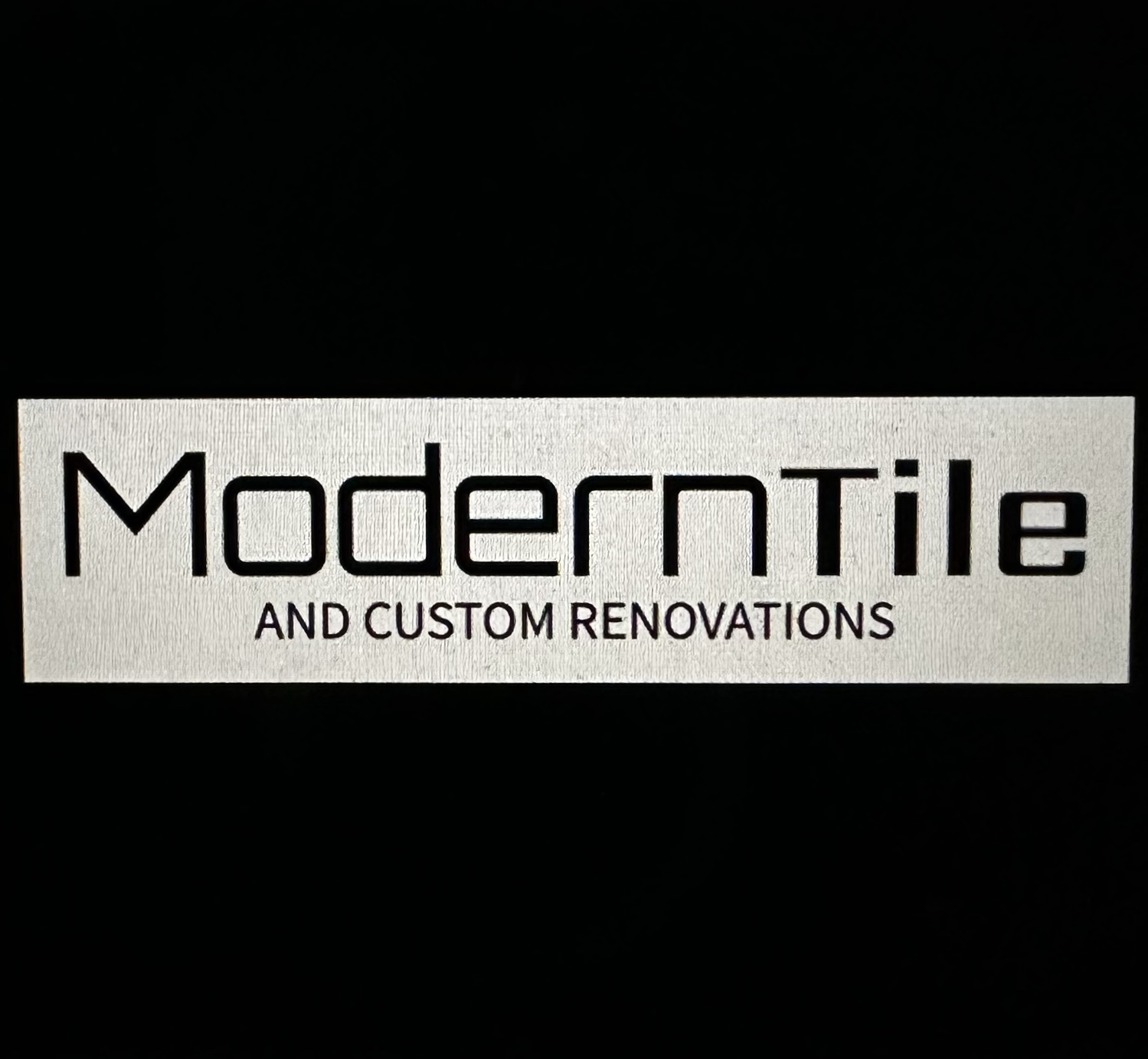 Modern Tile Inc.'s logo